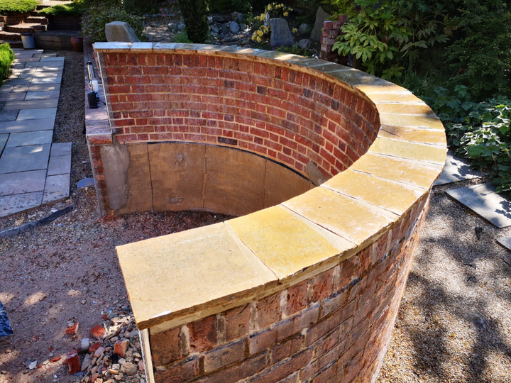 Flat coping stones cut and laid over existing brickwork