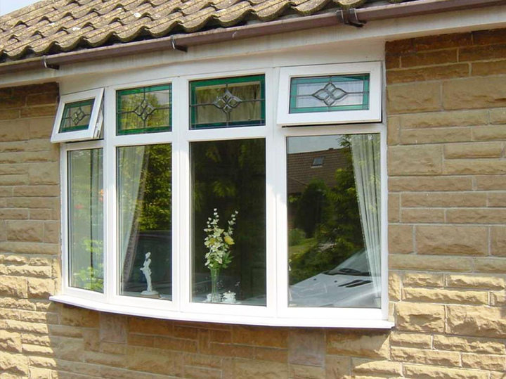 Bow window with stained glass vents